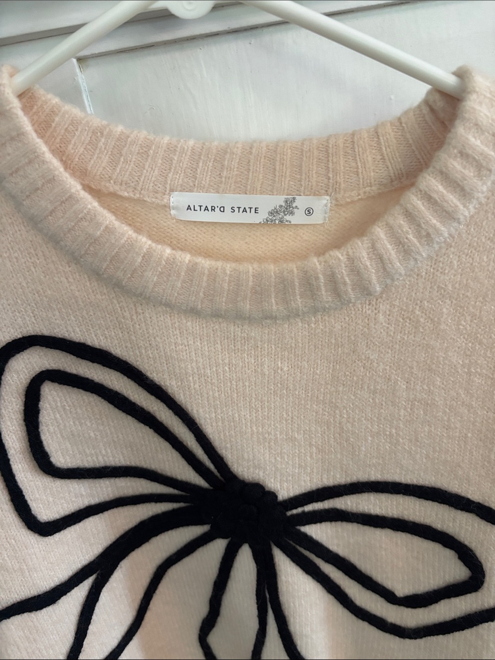 Altar'd State cream knit sweater with bold black 3D embroidered bow on the front - Picture 2 of 2